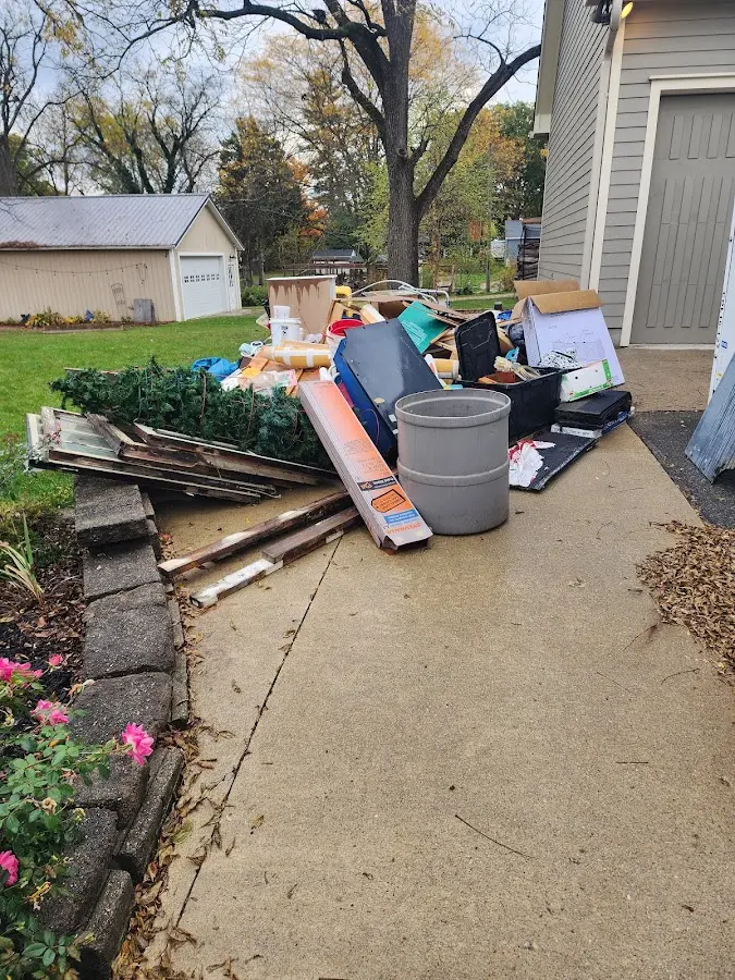 Dumpster being loaded with debris for 30 Yard Dumpster Rental in Raceland